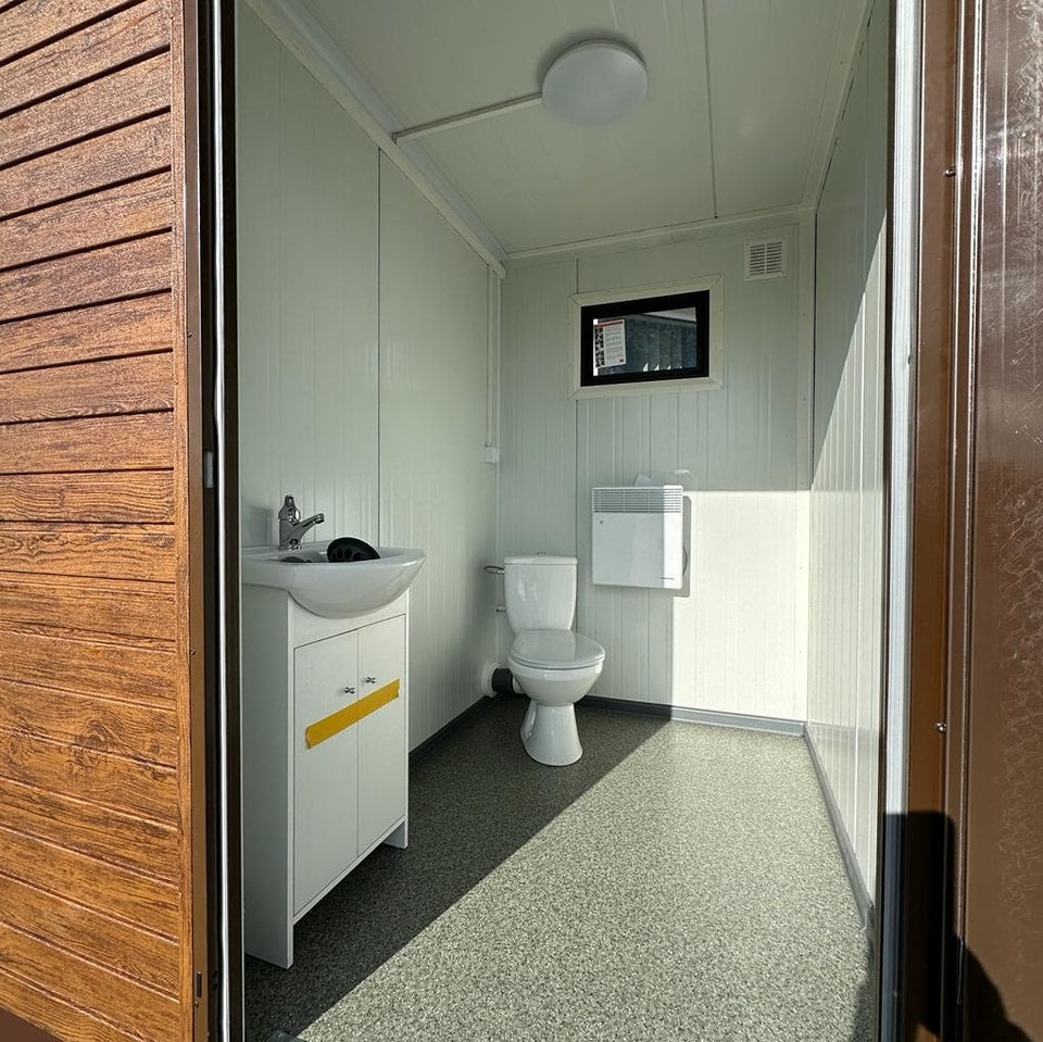 Contenedor sanitario con tanque de retención