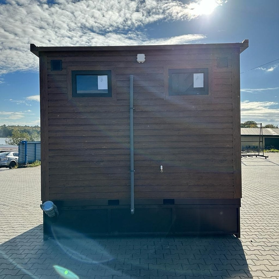 Contenedor sanitario con tanque de retención